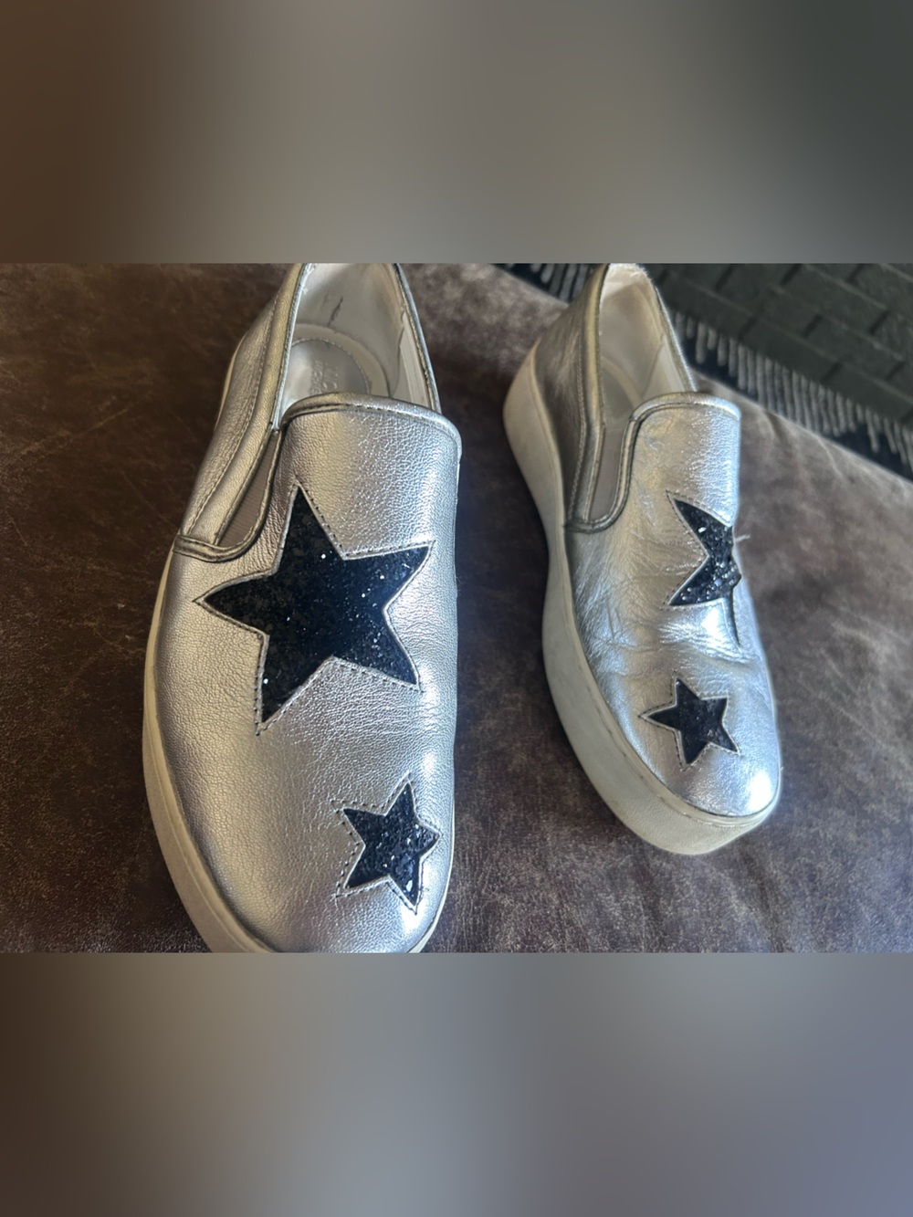 Michael Kors Silver Slip-On Sneakers with Black Star Details